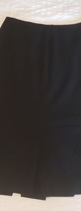 Midi length black skirt w/bottom pleats